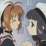 Sakura and Tomoyo from the series Cardcaptor Sakura. Tomoyo looks fondly at a smiling Sakura.